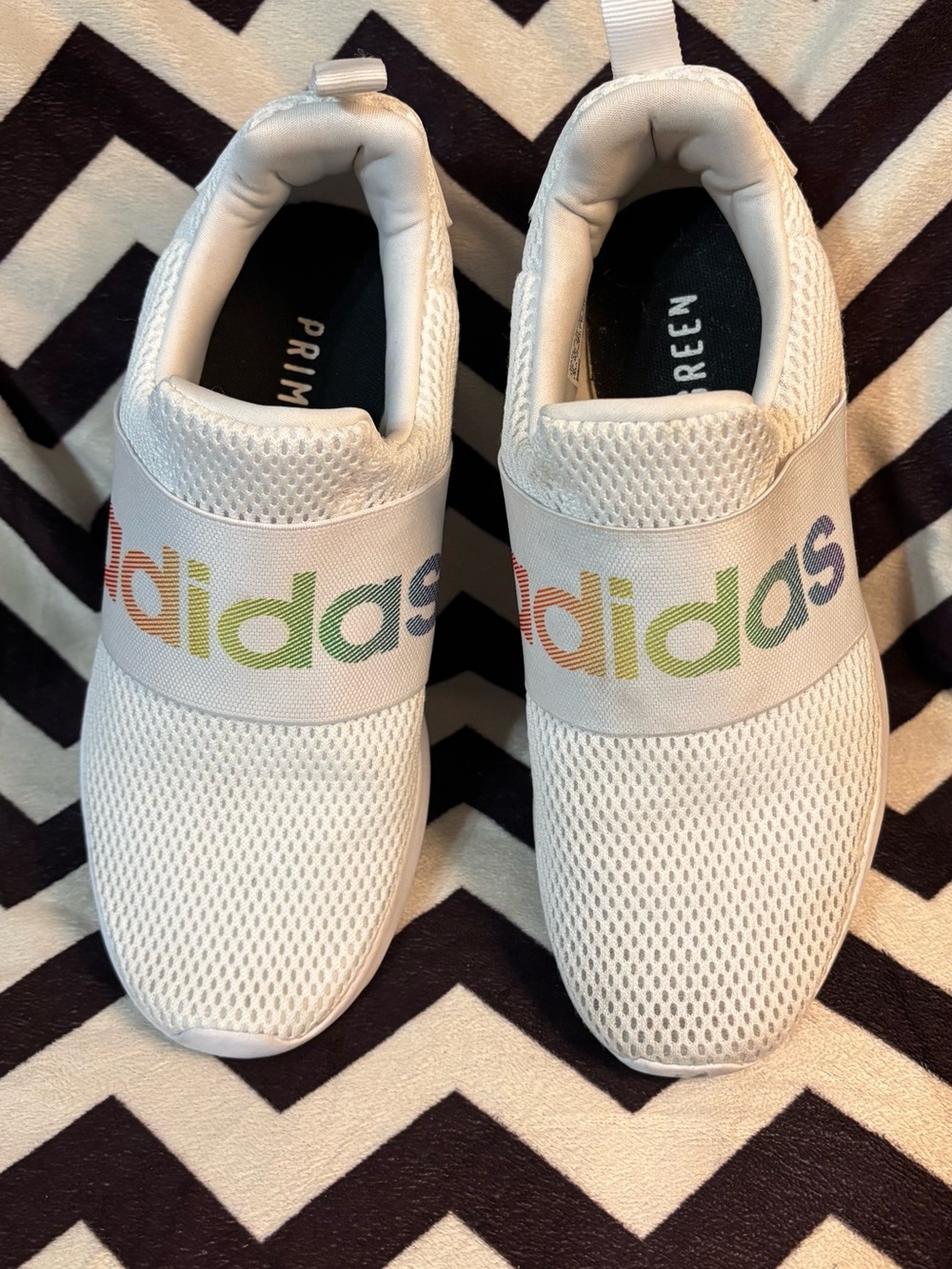 adidas Women’s White Slip-On Sneakers with Rainbow Logo